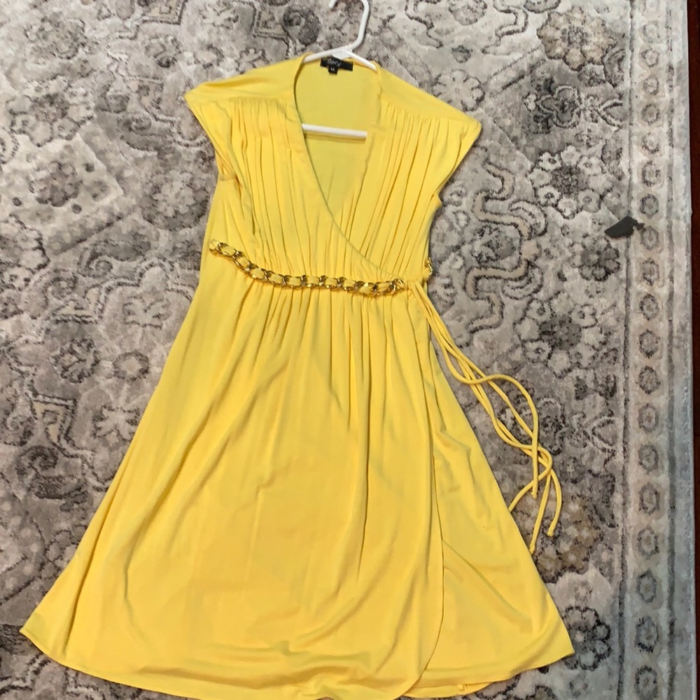 Yellow dress with gold chain under burst